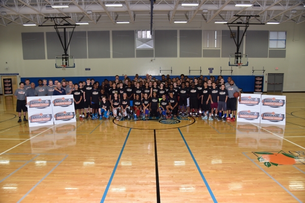Participants, coaches and special NBA guests commemorate their Gatorade Training Center experience with a center court photo. 